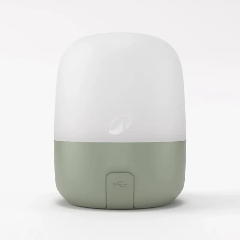 Quechua BL200 lantern with a white dome and green base.