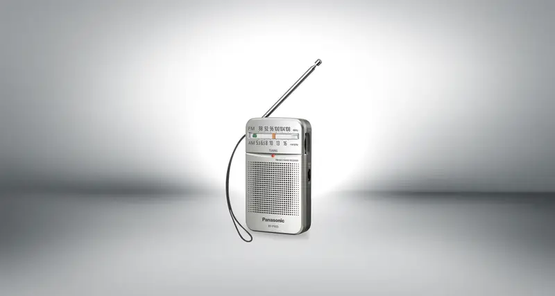 A small silver Panasonic RF-P50D pocket radio with its aerial raised.